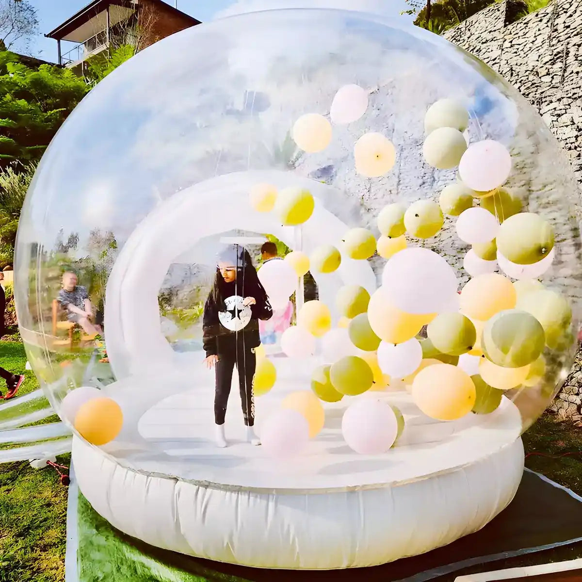 Artistic shot of kid with balloons flowing in the Bubble Bounce House