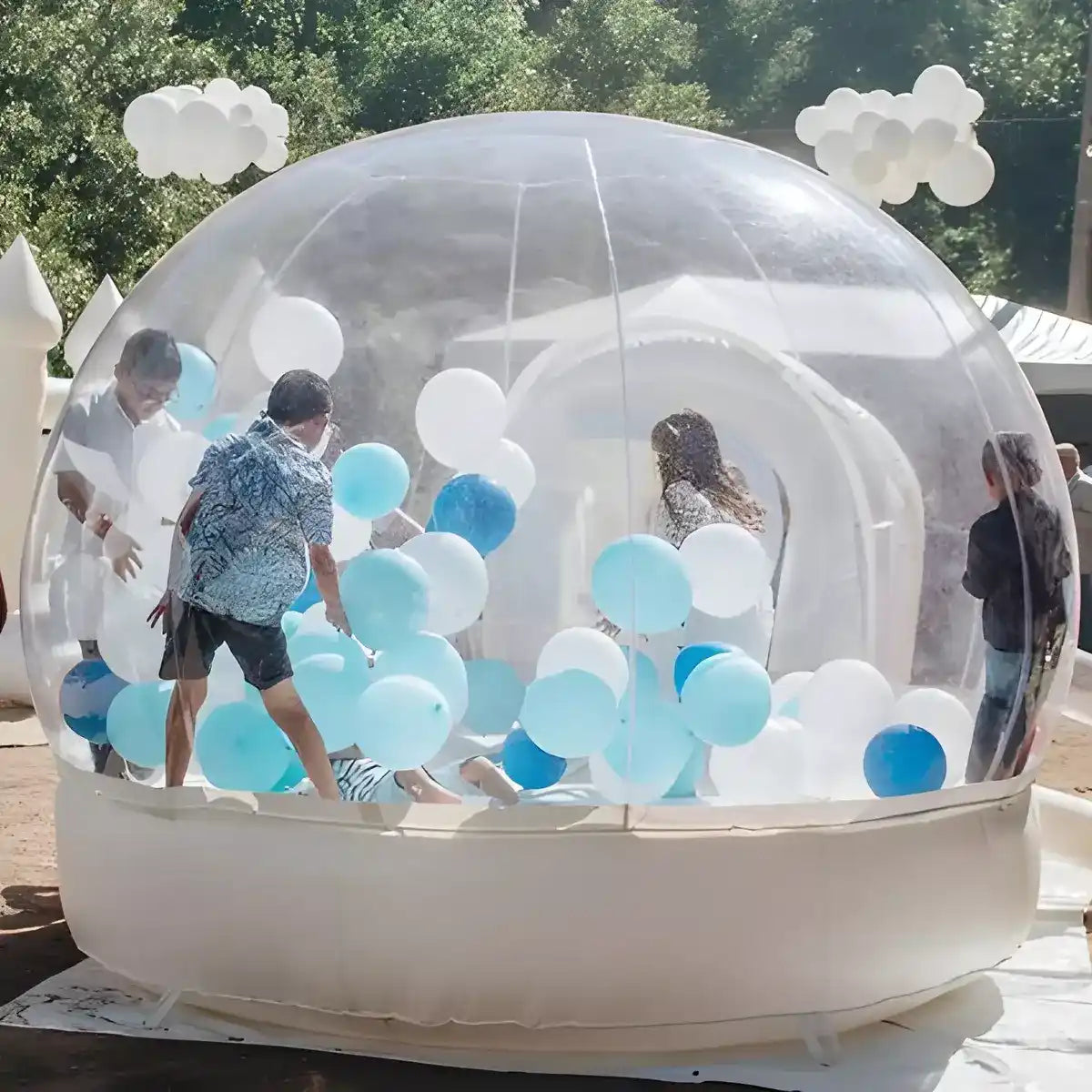 The Bubble Bounce House filled with blue balloons and happy kids