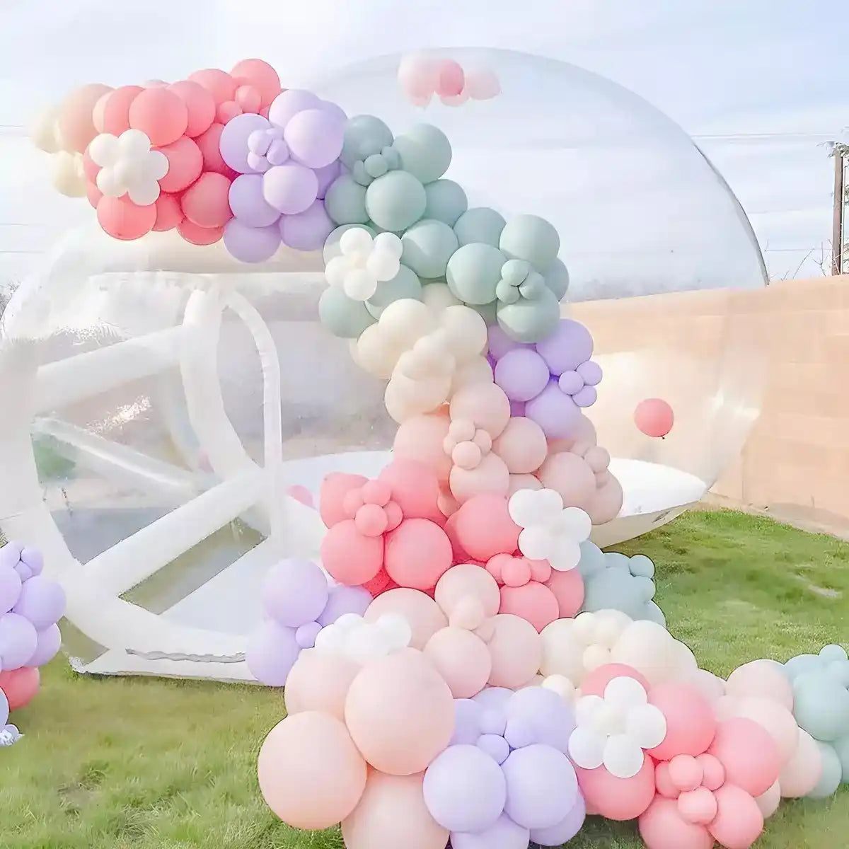 The Bubble House decorated with colorful balloons in backyard