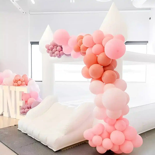 Indoor mini bounce house decorated with balloons