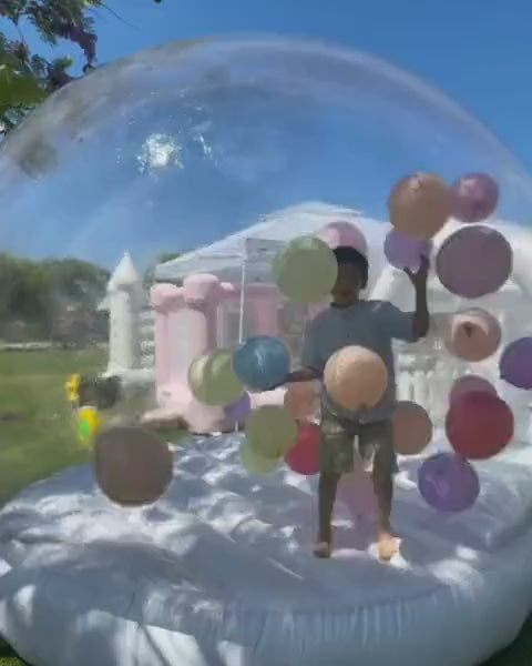Bubble Bounce House where happy kids playing with balloons inside