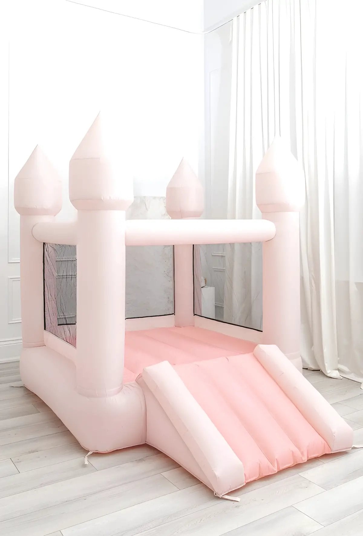 Pastel Little Bounce, pink bounce house, placed in the living room