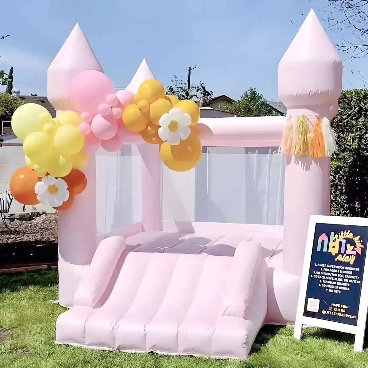 Paste Little Bounce, pink mini bounce house, with balloons and ready for party