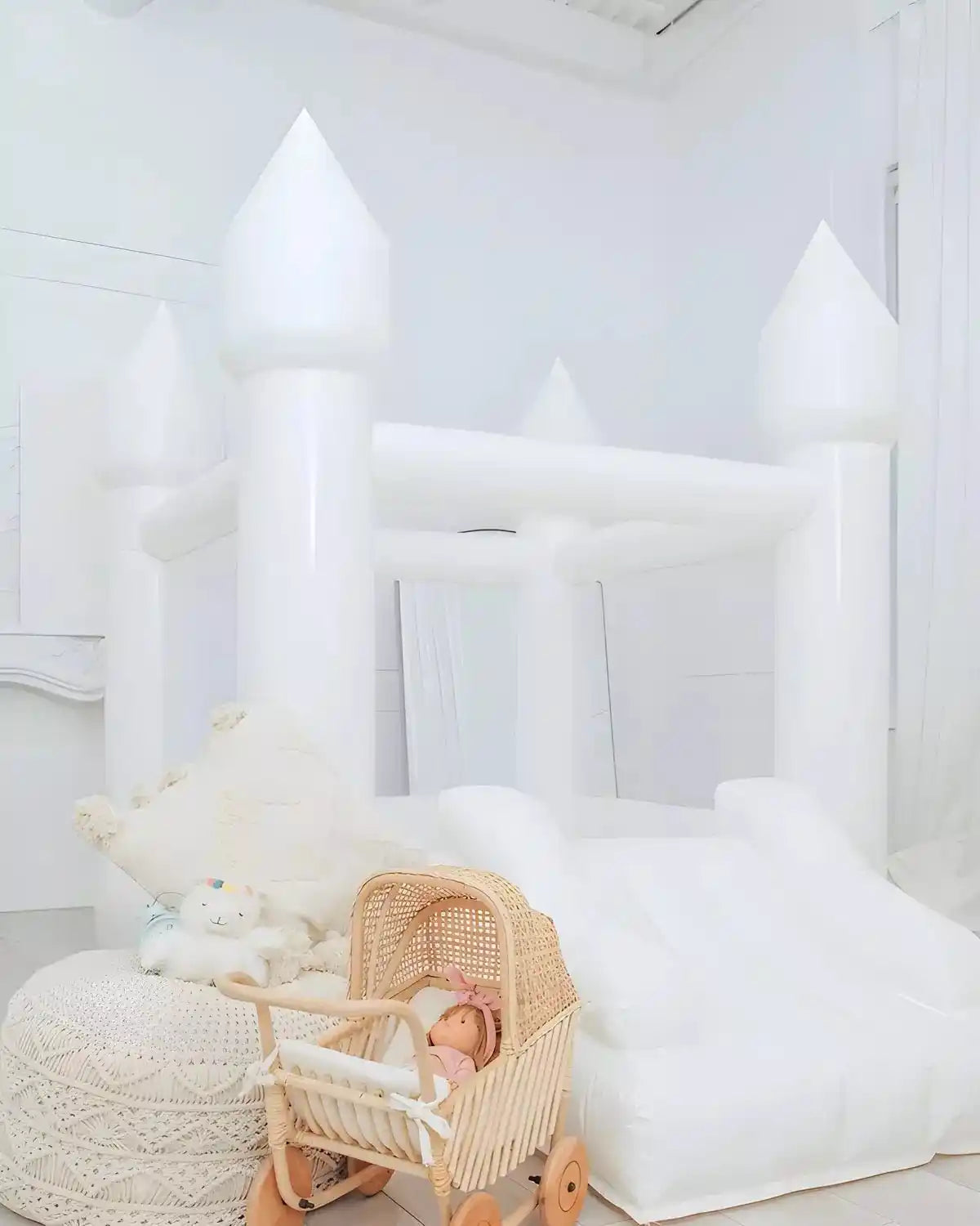 Tiny white bounce houses with plushy toys and baby carts